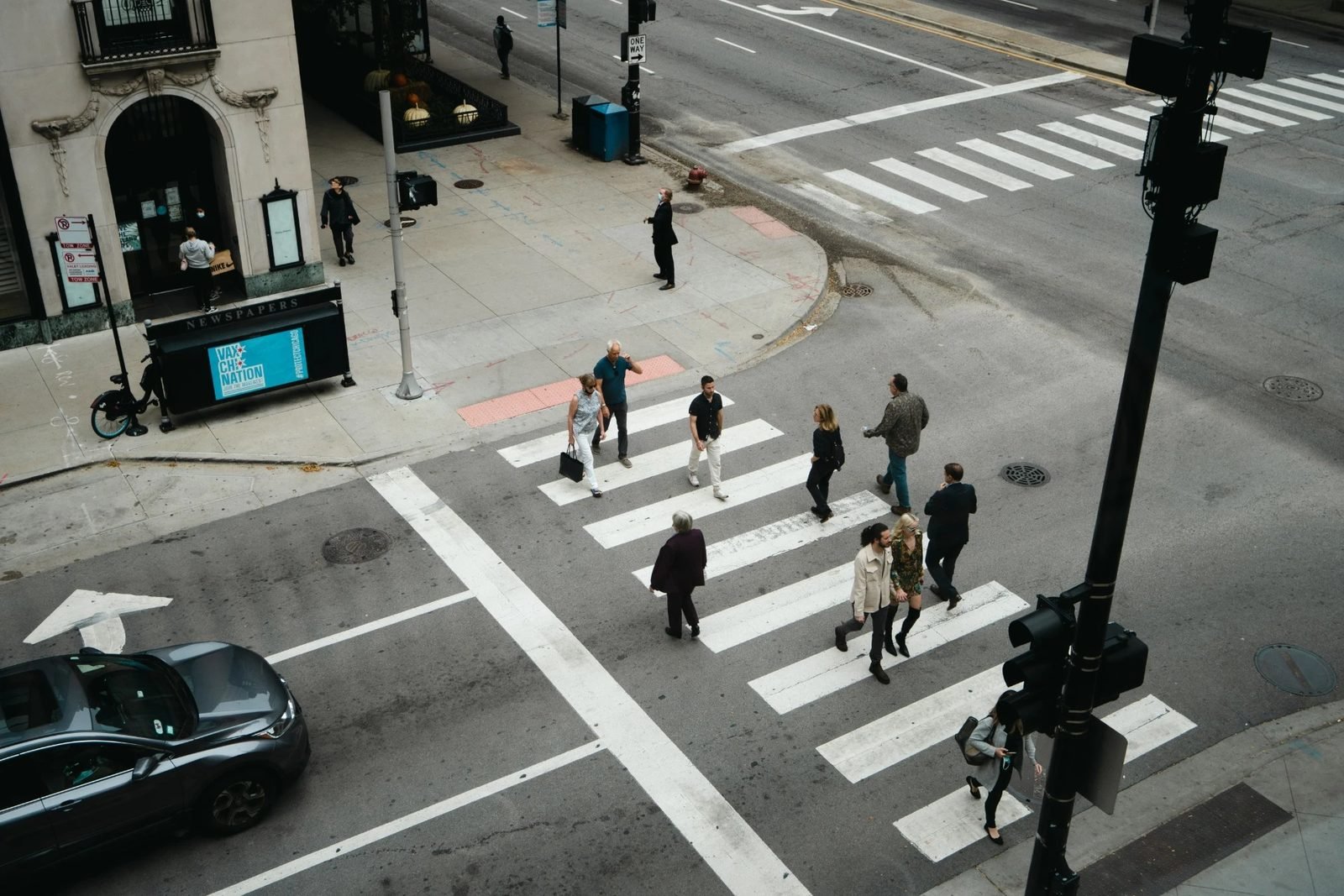 Pedestrian crossing at a suburban intersection.